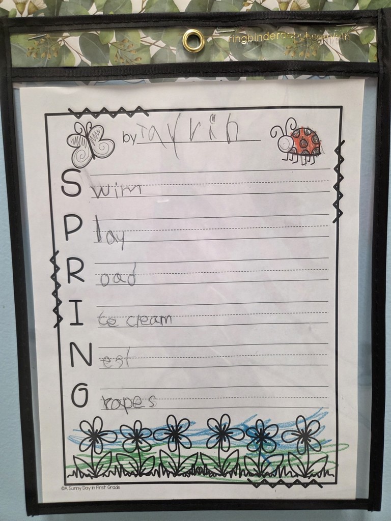 1st grade student Tayvin uses an acrostic poem to describe spring as "swim, play, road, icecream, nest, and grapes."