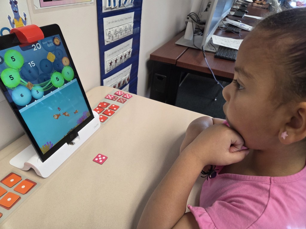A kindergarten student almost has a full fishtank on OSMO numbers.