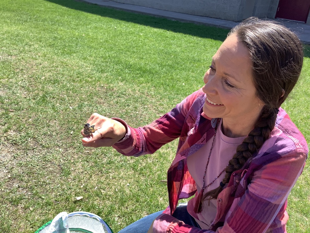Lucky Ms. Laura got to help the last butterfly out of the enclosure.