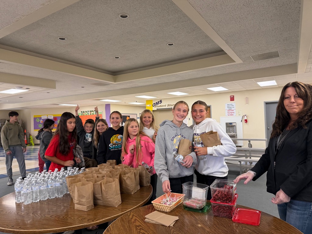 Middle school kids getting popcorn and other snacks