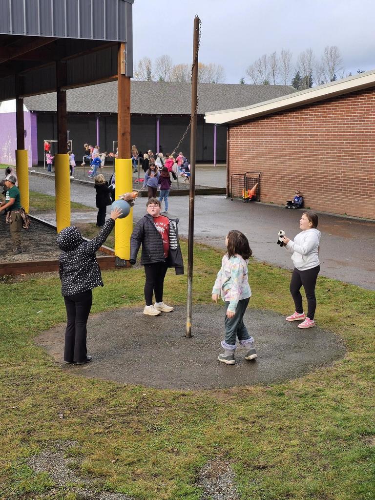 Students playing tether ball