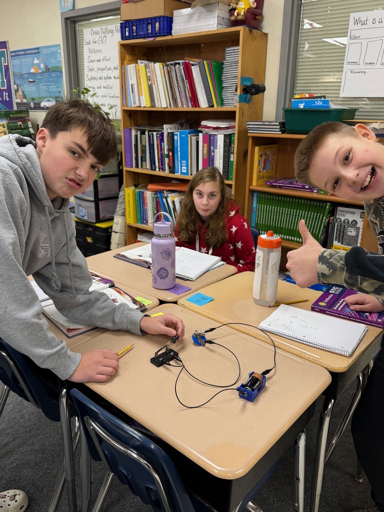 Middle school students with their finished experiment