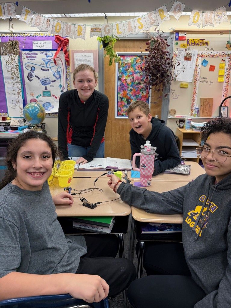 Middle school students with their finished experiments