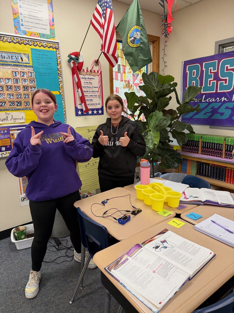 Middle school students with their finished experiments