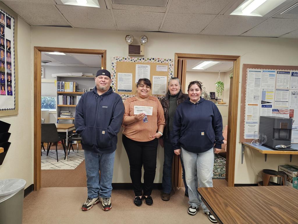 The organizers of the Ony Icicle 5k Fun Run and Superintendent Brenda Padgett posing with the check donated from the fun run