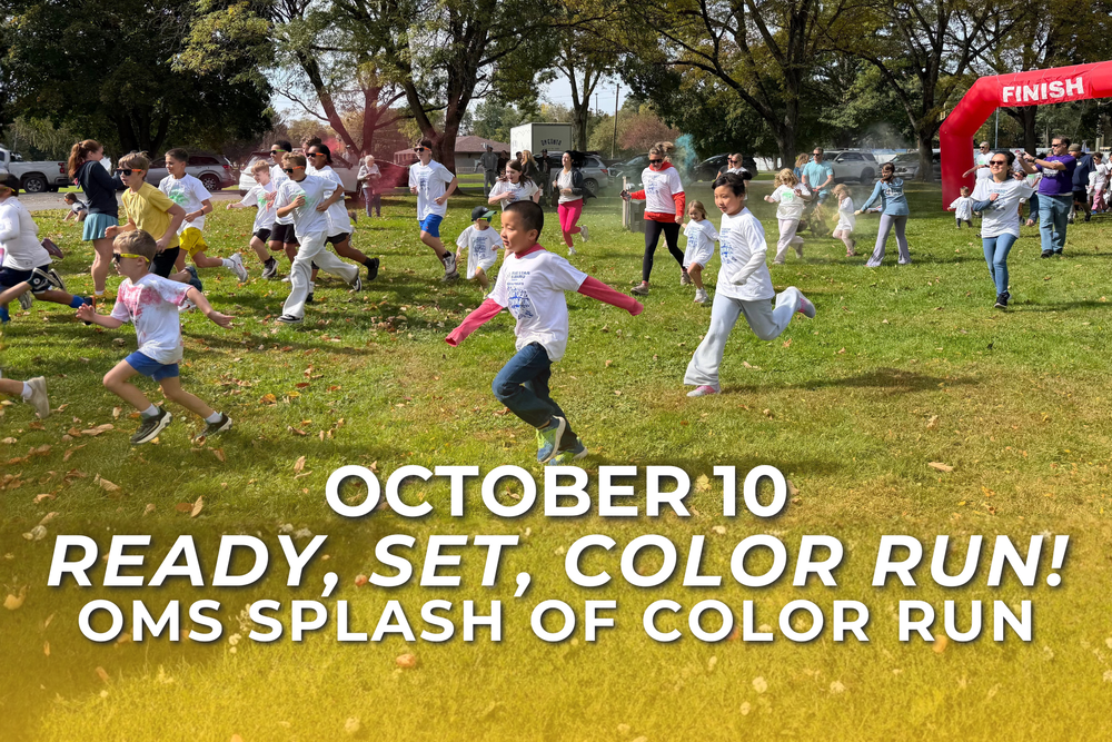 Children and adults run across the grass through clouds of colored powder at Neahwa Park. Text reads, “October 10. Ready, Set, Color Run! OMS Splash of Color Run.”