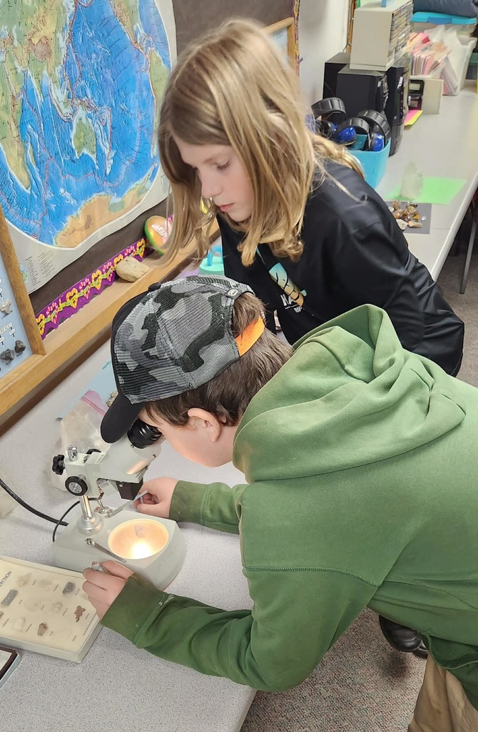 Checking for crystals in the rocks with the microscope