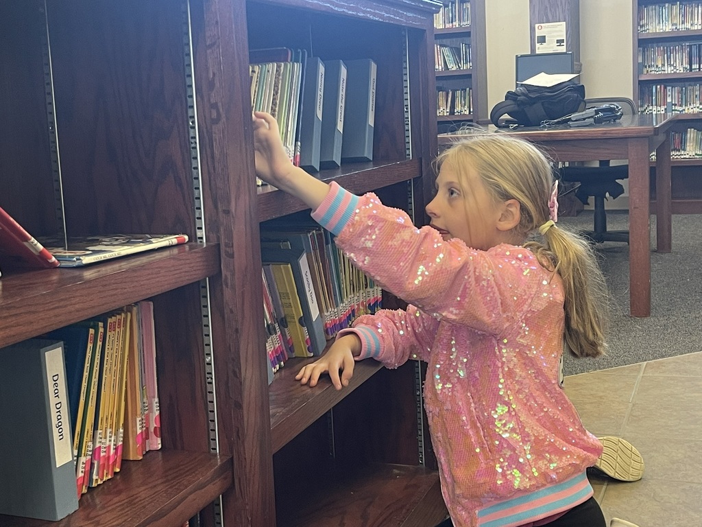 2nd grade student selecting book