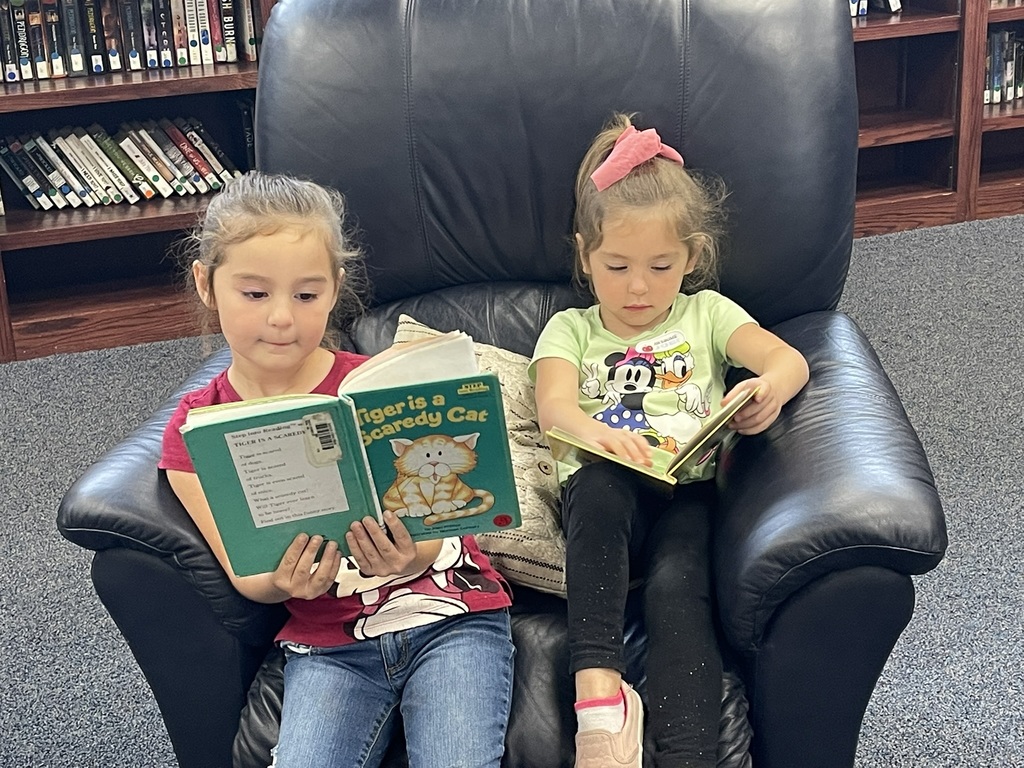 students looking at books