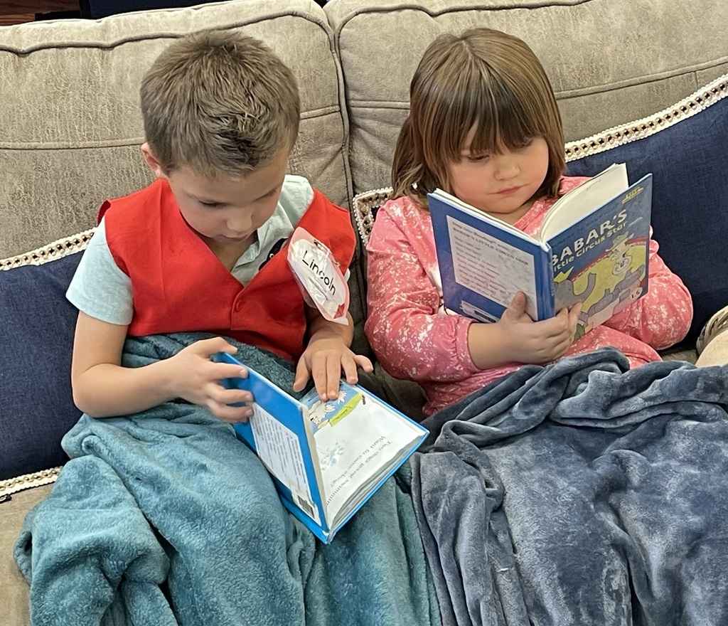 students looking at books