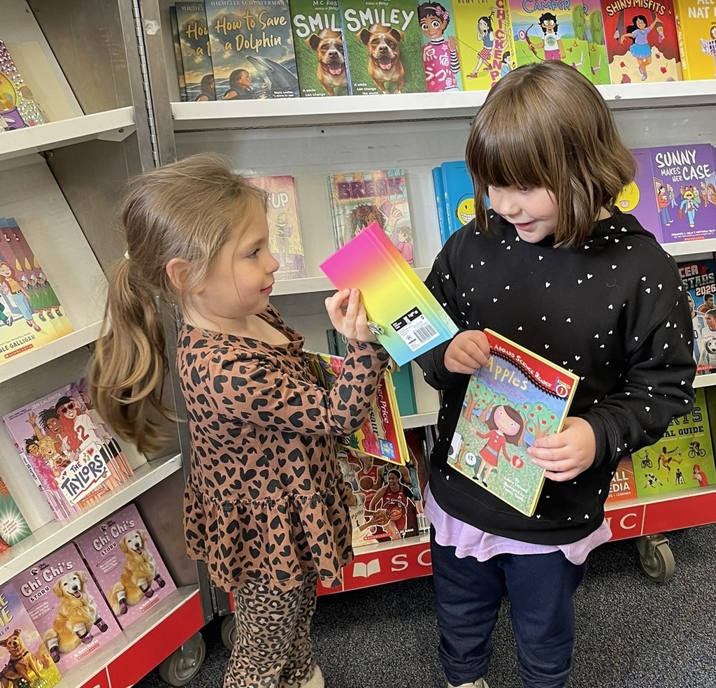 student showing selected book