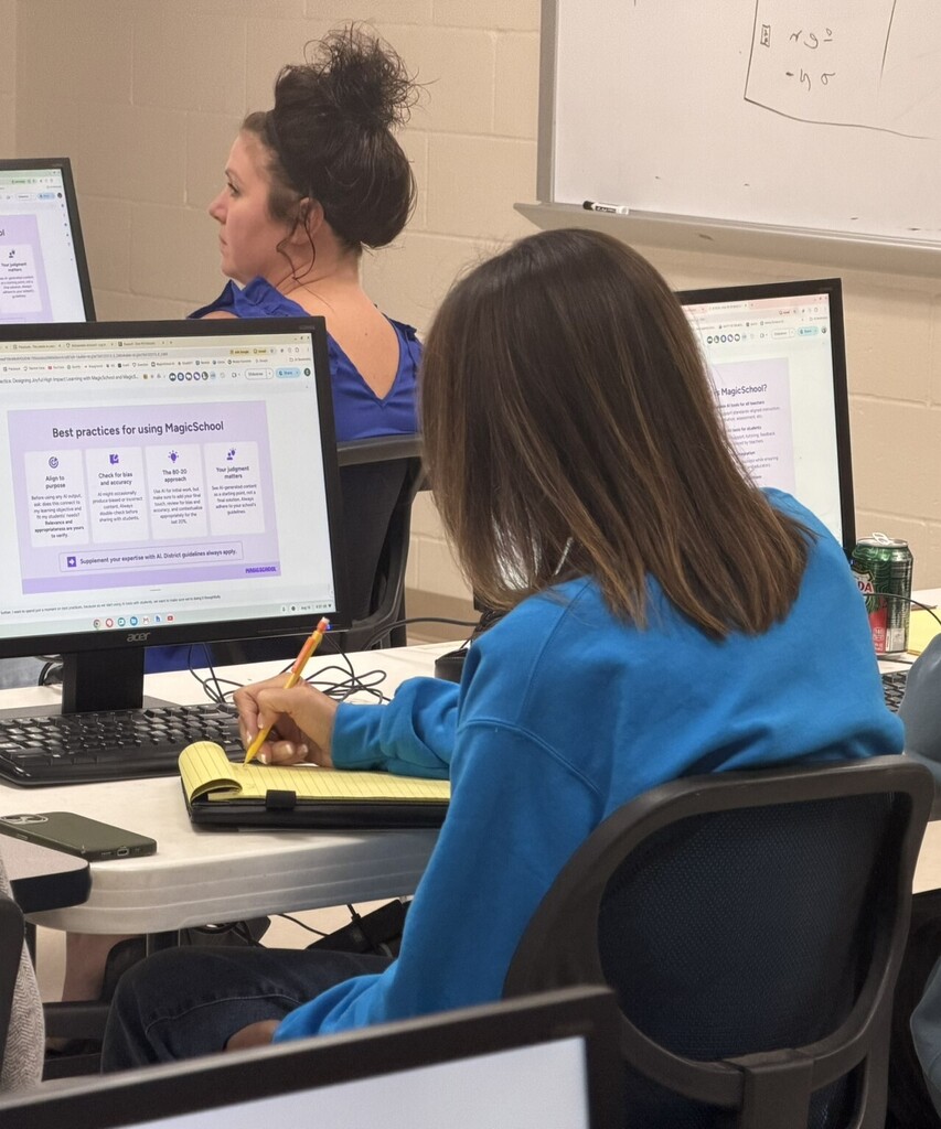 Educator takes notes while viewing a computer screen showing best practices for using MagicSchool AI tools.