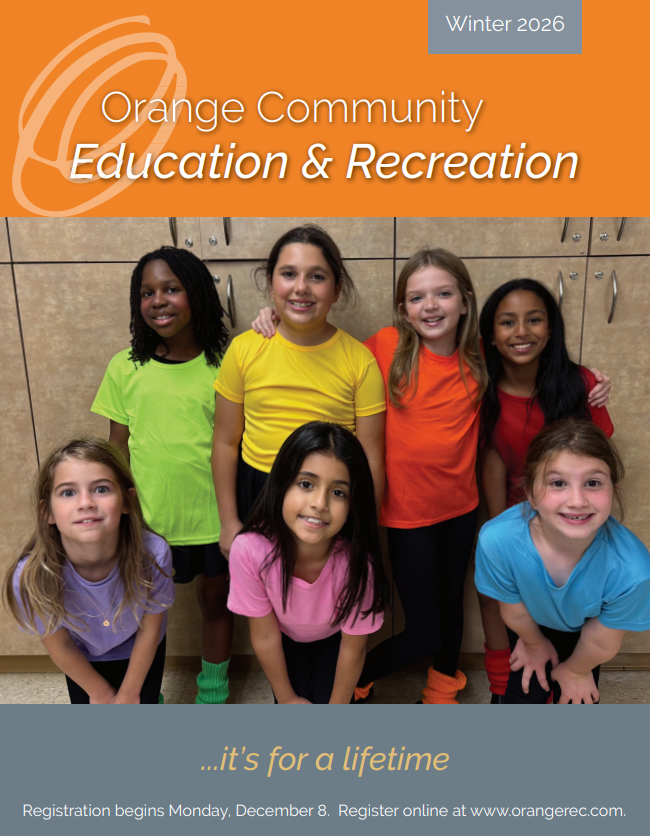 Kids in colorful shirts, smiling and looking at the camera