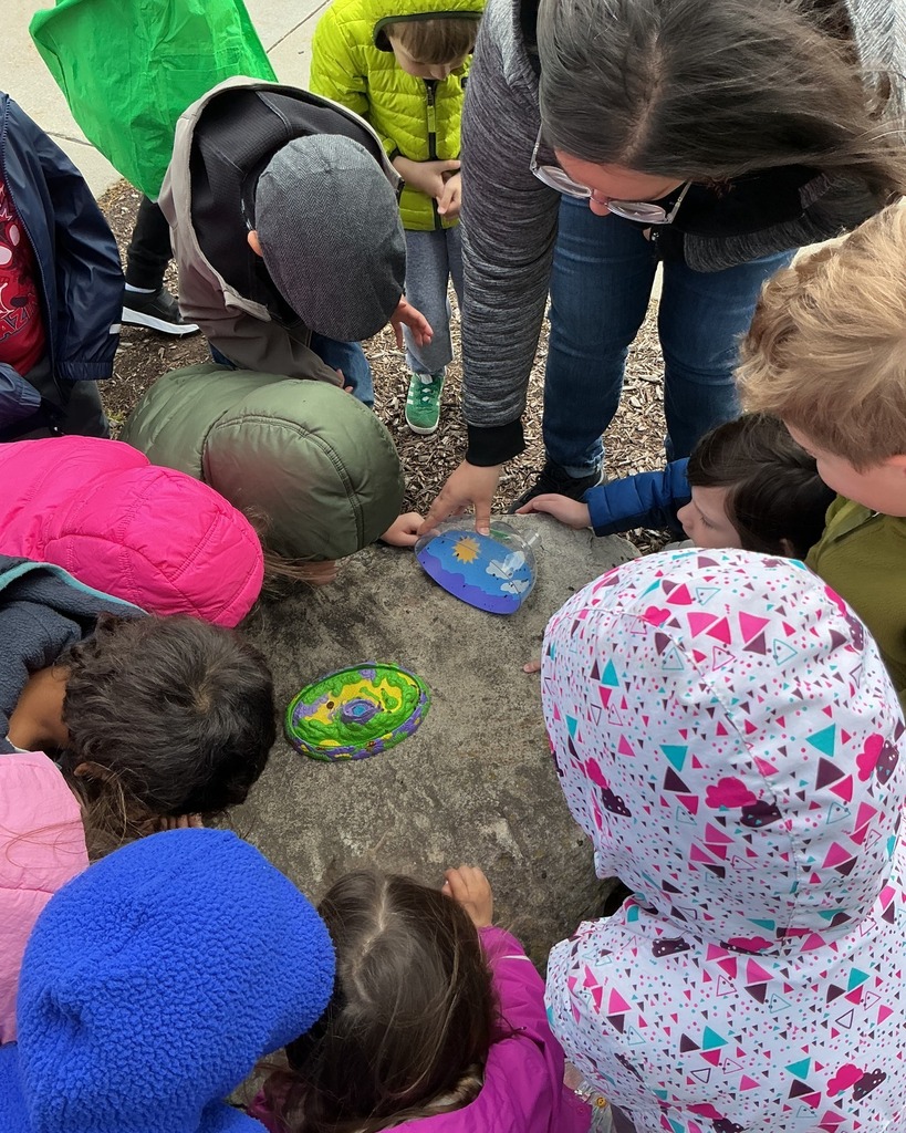 A group of preschool students bring ladybugs outside 