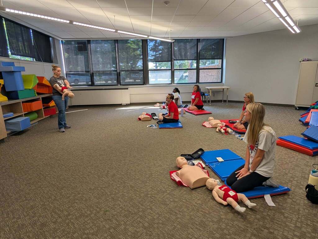 A group of people in a CPR class