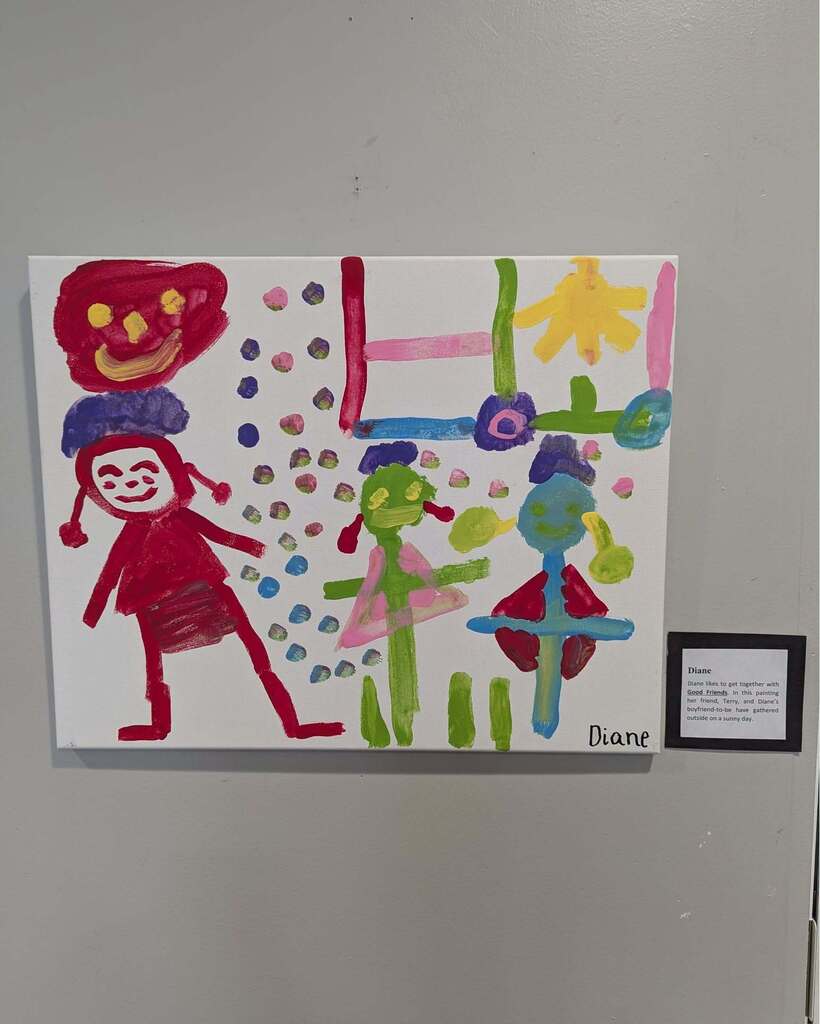 A painting of a "happy day" and "best friend" displayed on the wall of the Orange Senior Center