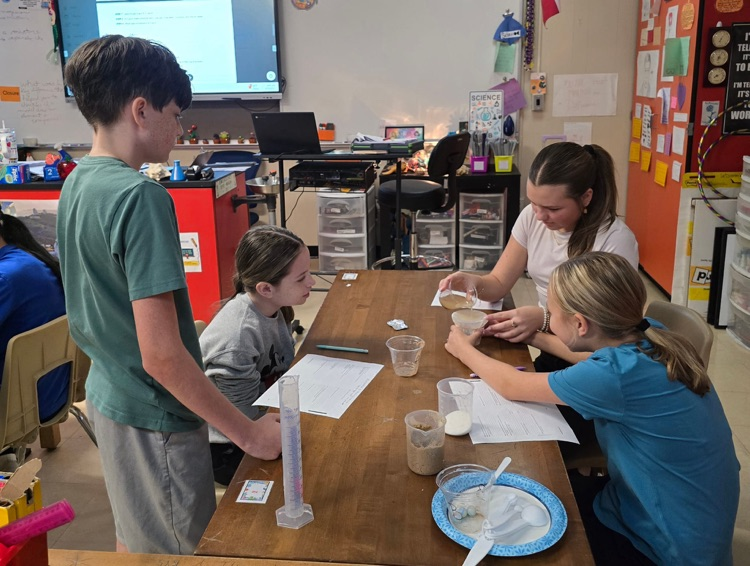 8th grade students completing a lab in science.