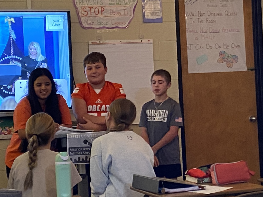7th grade students giving a "press conference" during ELA class.