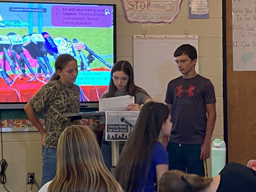 7th grade students giving a "press conference" during ELA class.
