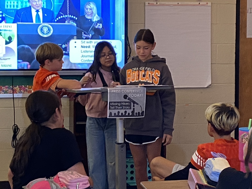 7th grade students giving a "press conference" during ELA class.