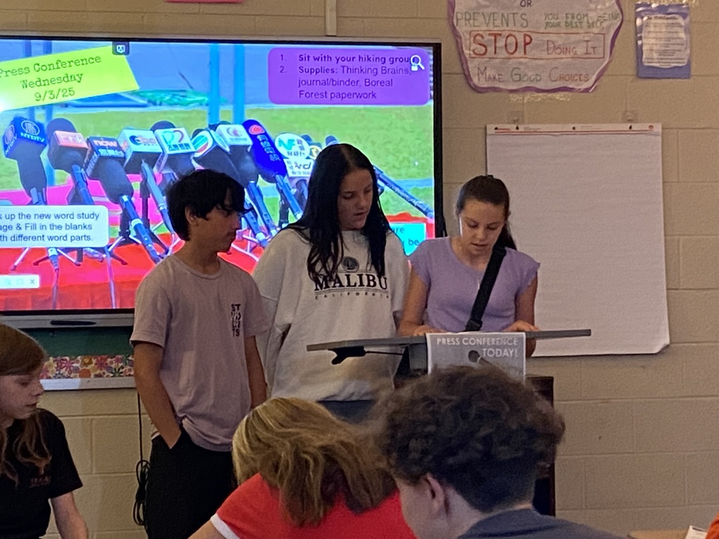 7th grade students giving a "press conference" during ELA class.