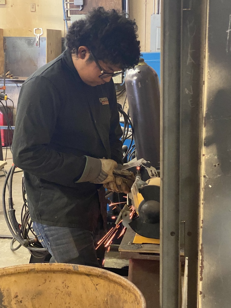 welding student grinding