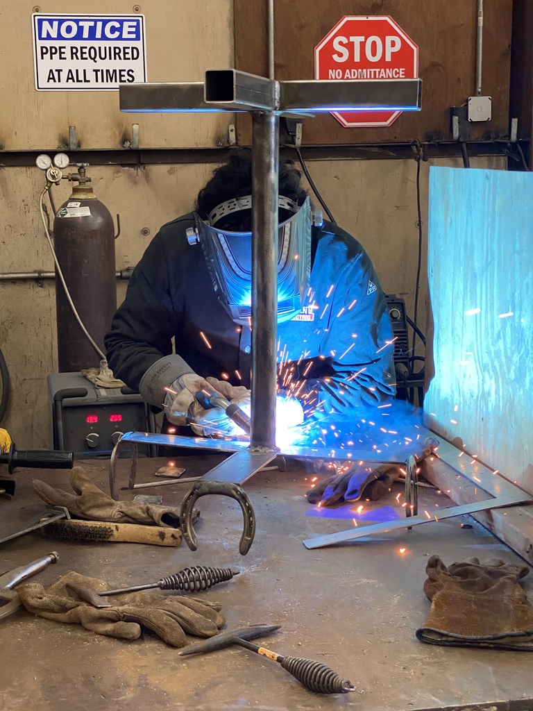 welding student working on a stand