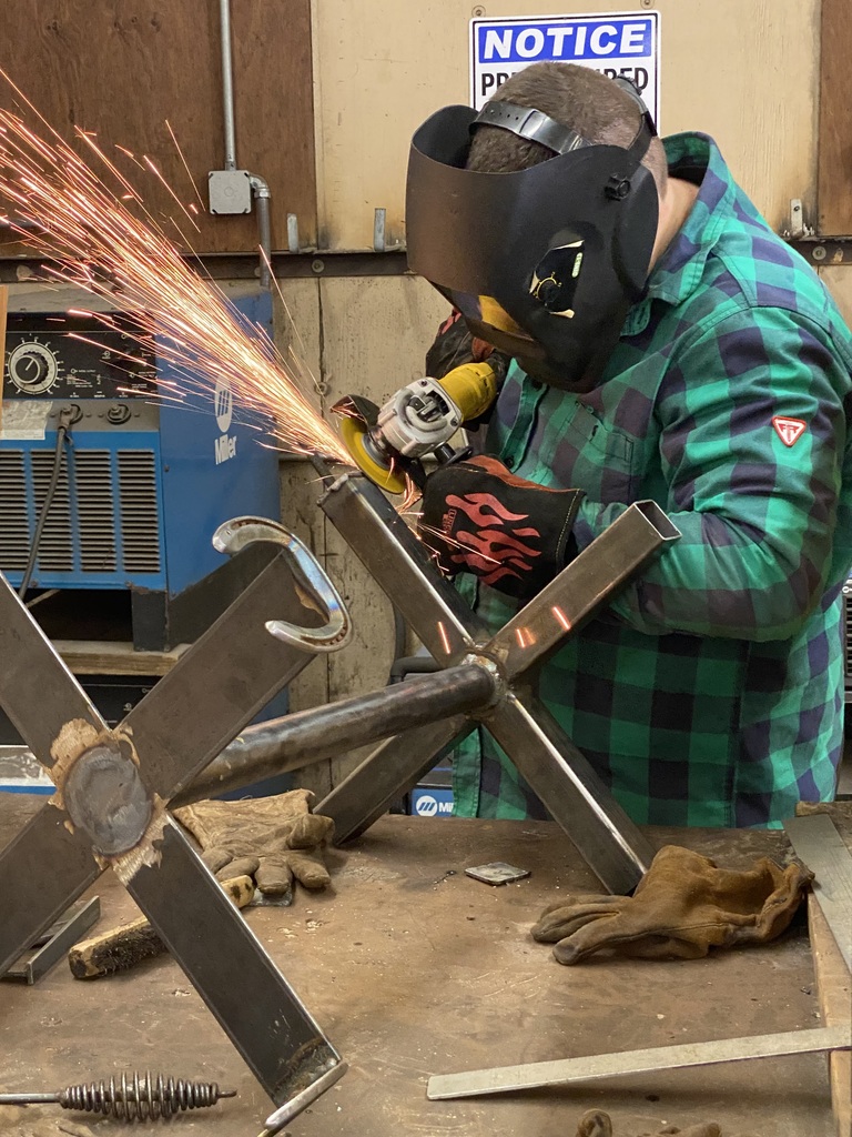welding student working on a stand