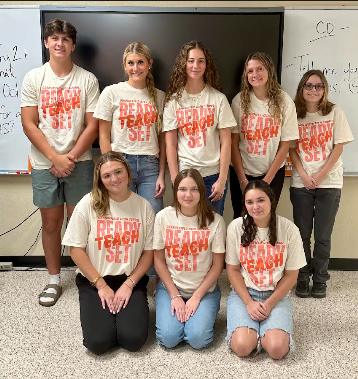 eight students wearing ready set teach shirts