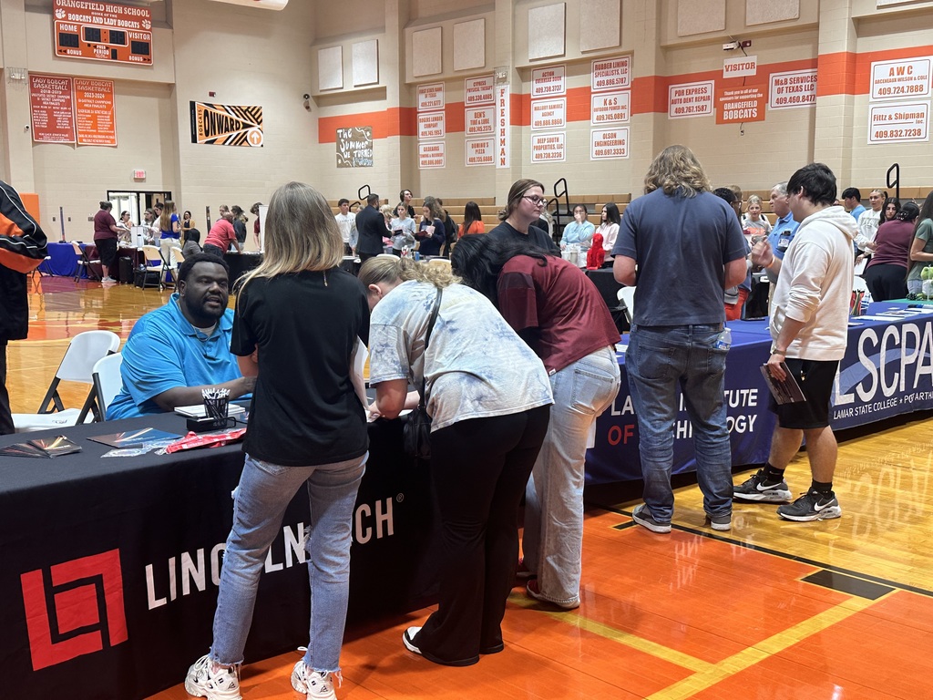 students visiting a college booth