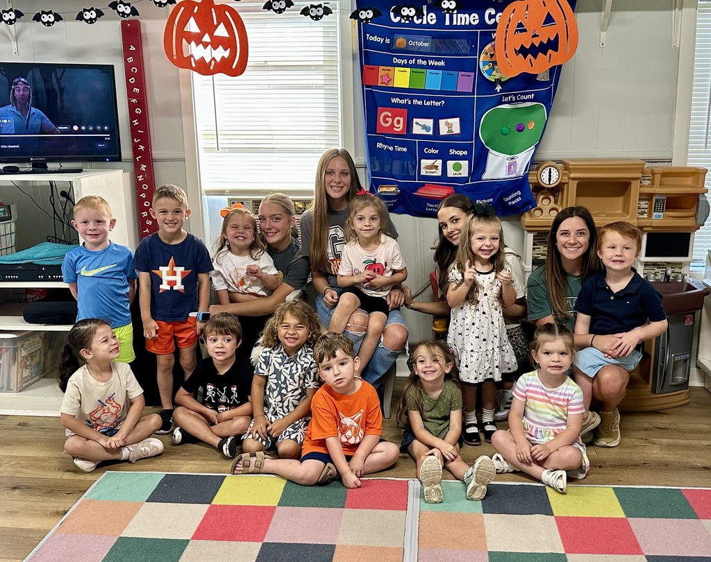small children on reading rug