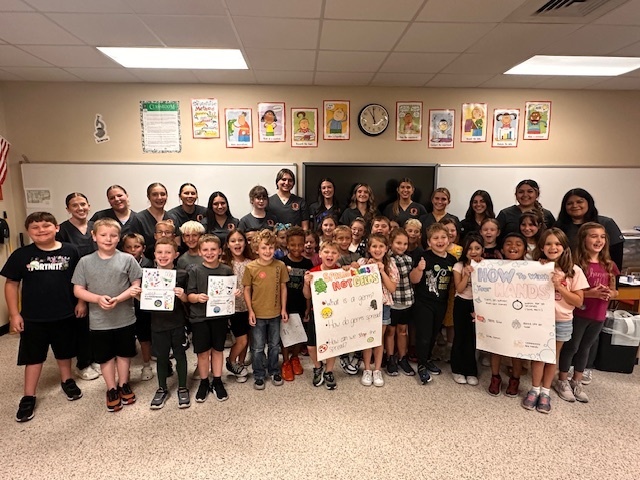 group of young students holding signs