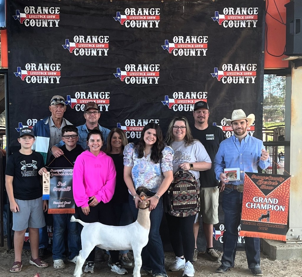 goat with family and banner