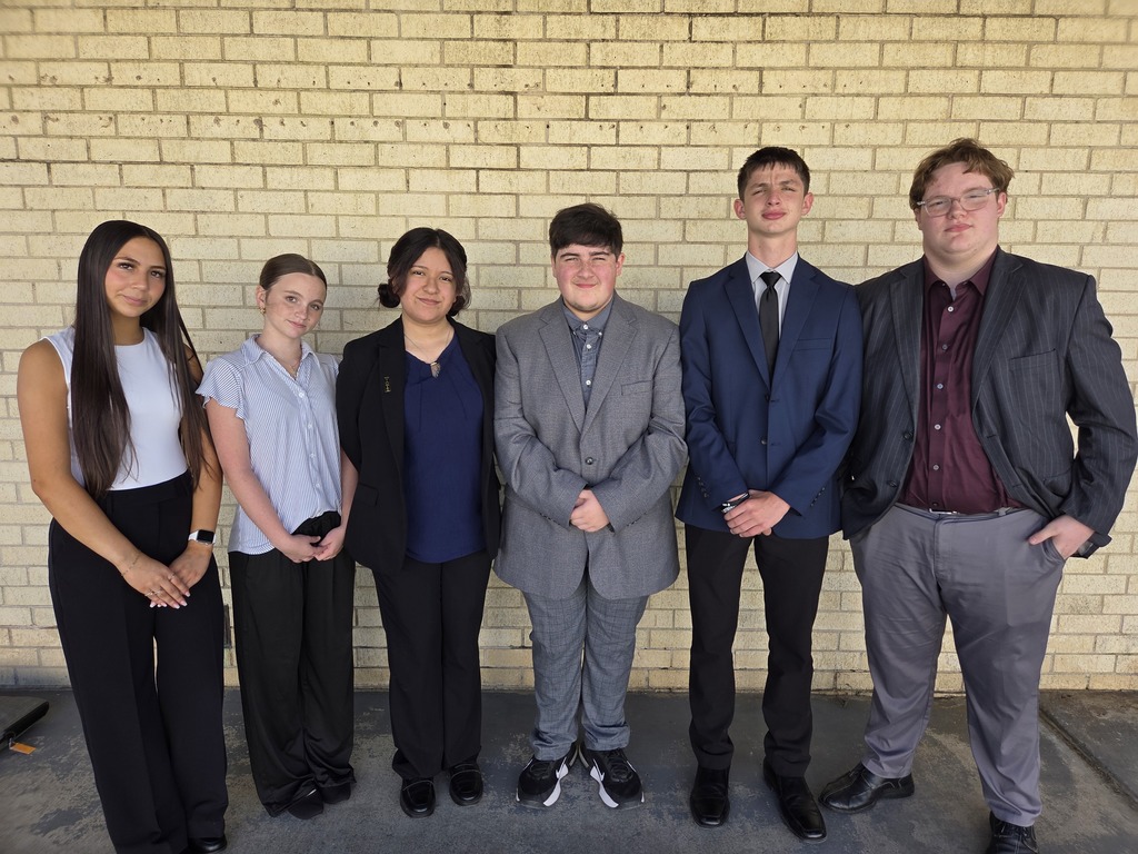 six students dressed to compete in debate
