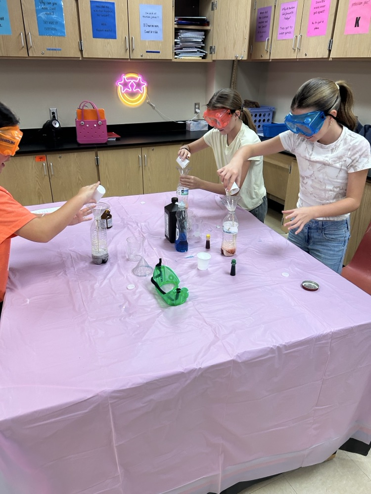 6th grade students completing a science lab
