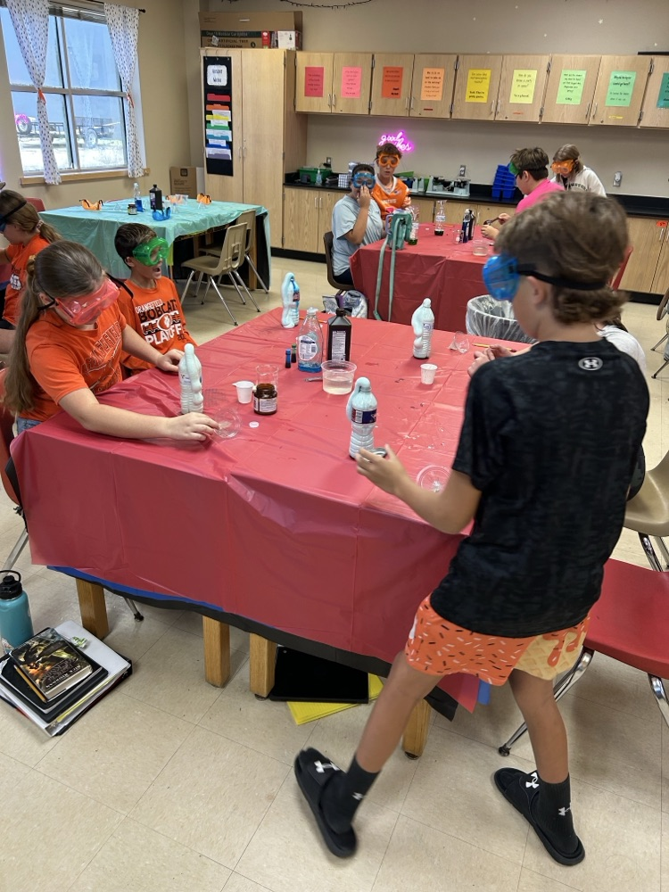 6th grade students completing a science lab