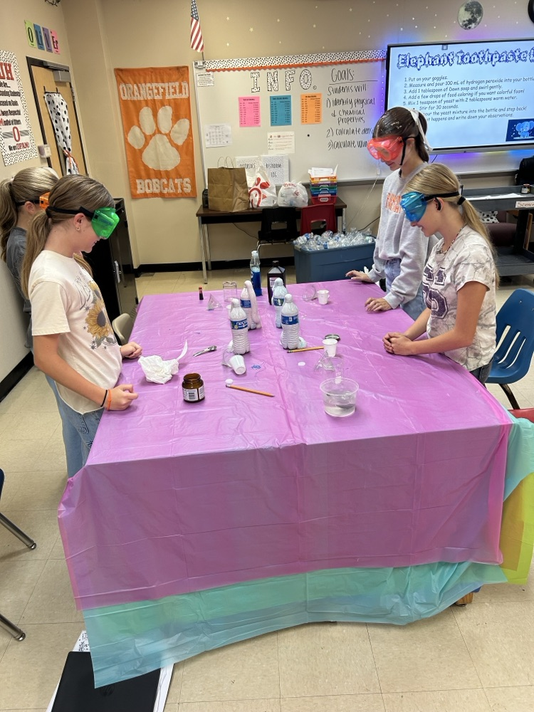 6th grade students completing a science lab