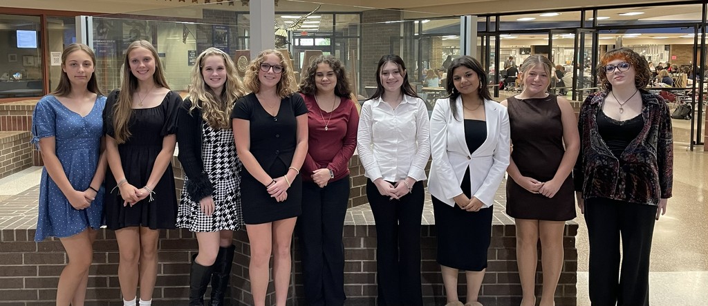 nine students dressed to compete in speaking events