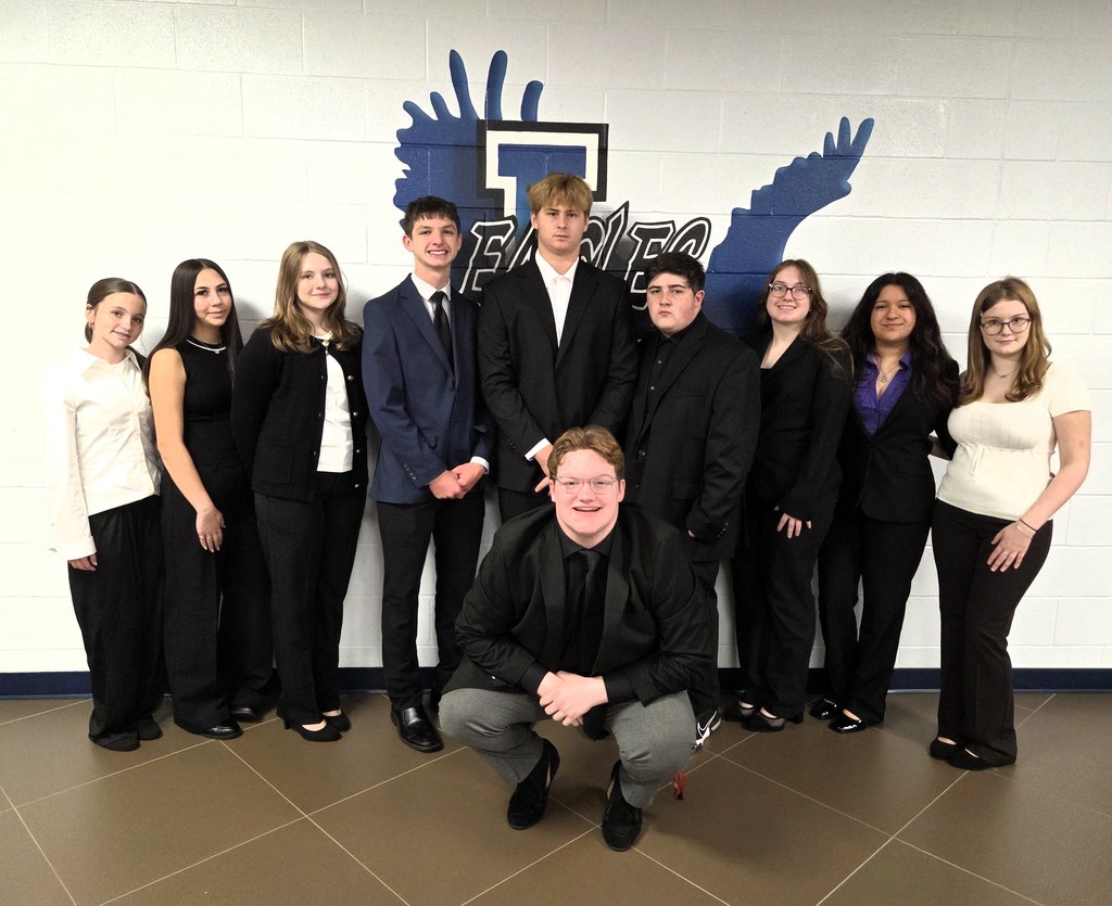 ten students dressed for debate