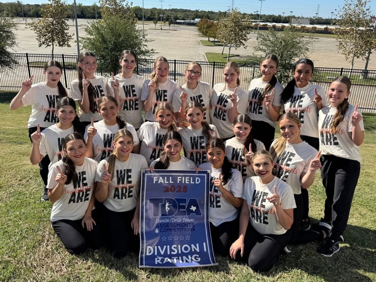 girls holding. division one banner