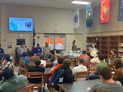 students watching a presentation in a library