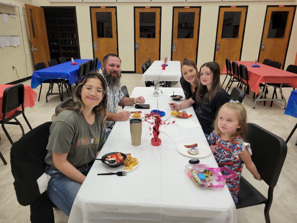 A veteran and their family enjoying the veteran's breakfast.