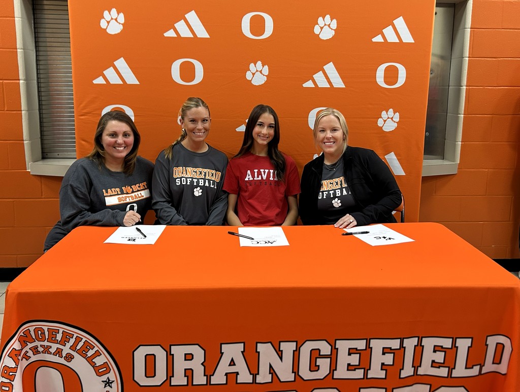 two coaches and a student in a red shirt followed by a third coach