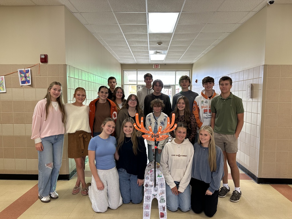 students posing with reindeer