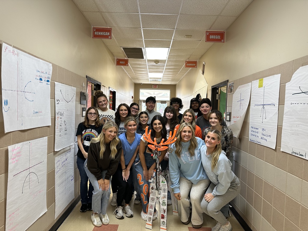 students posing with reindeer