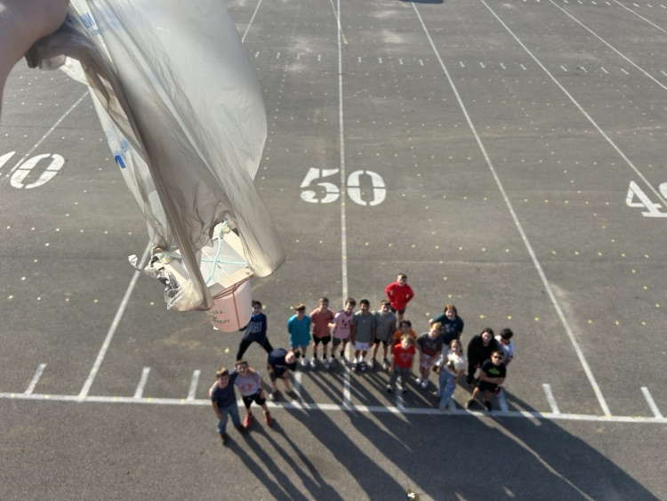 Students watching the eggs take a 25’ drop.