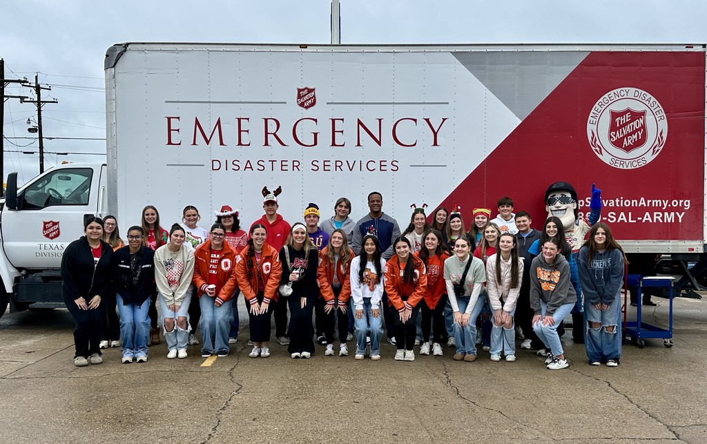 students in front of a Salvation Army truck with Mayor Spears
