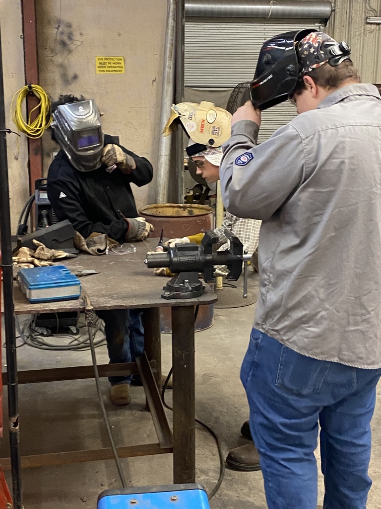 students welding