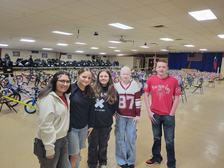 OJH STUCO members pose for a photo while passing out gifts.