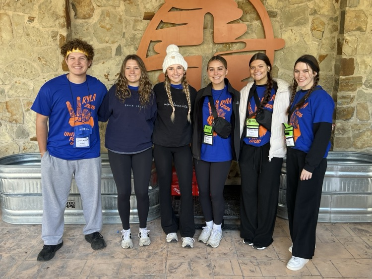 six students with blue shirts